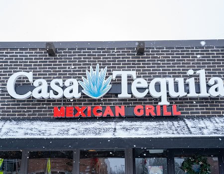 Casa Tequila Mexican Grill & Cantina exterior sign in snowy weather.