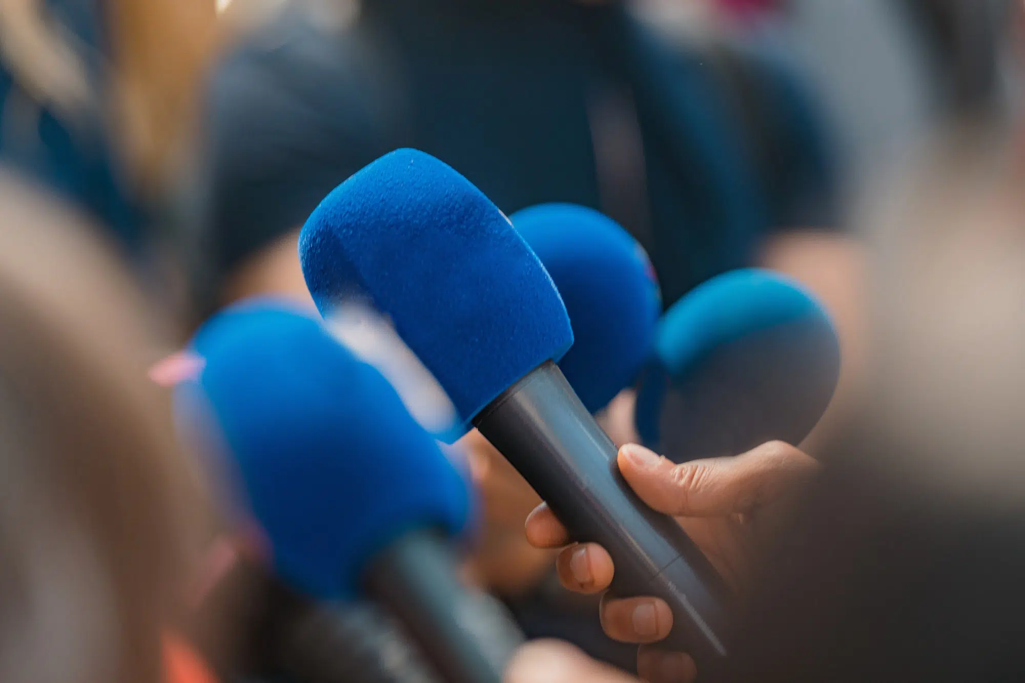 News reporters interviewing a politician.