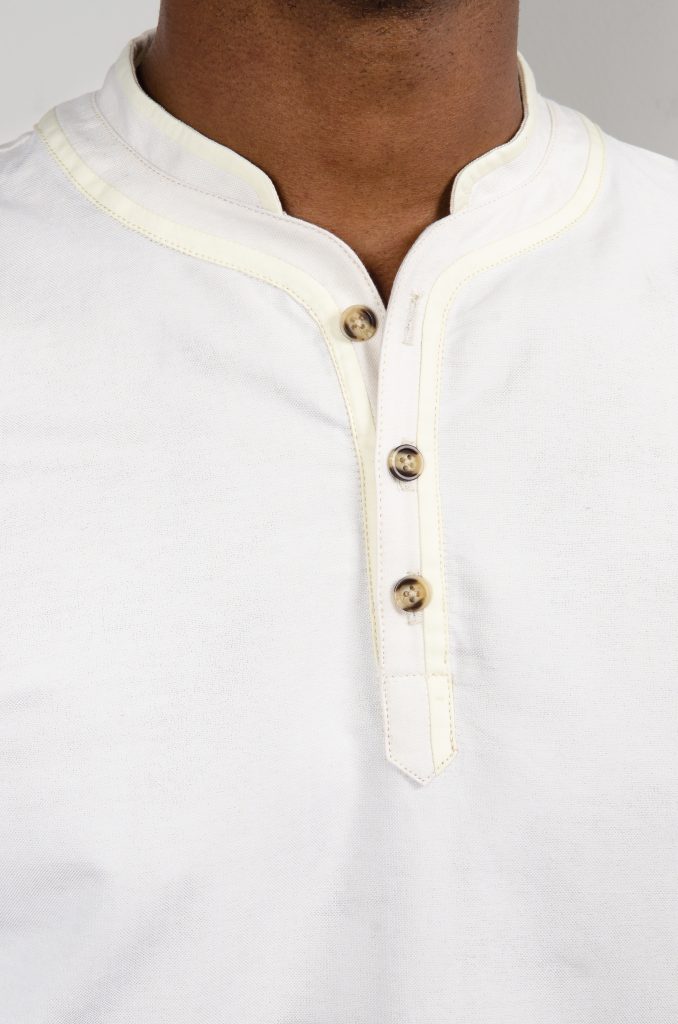 Cream polo shirt with button-up collar from Bryden Apparel.