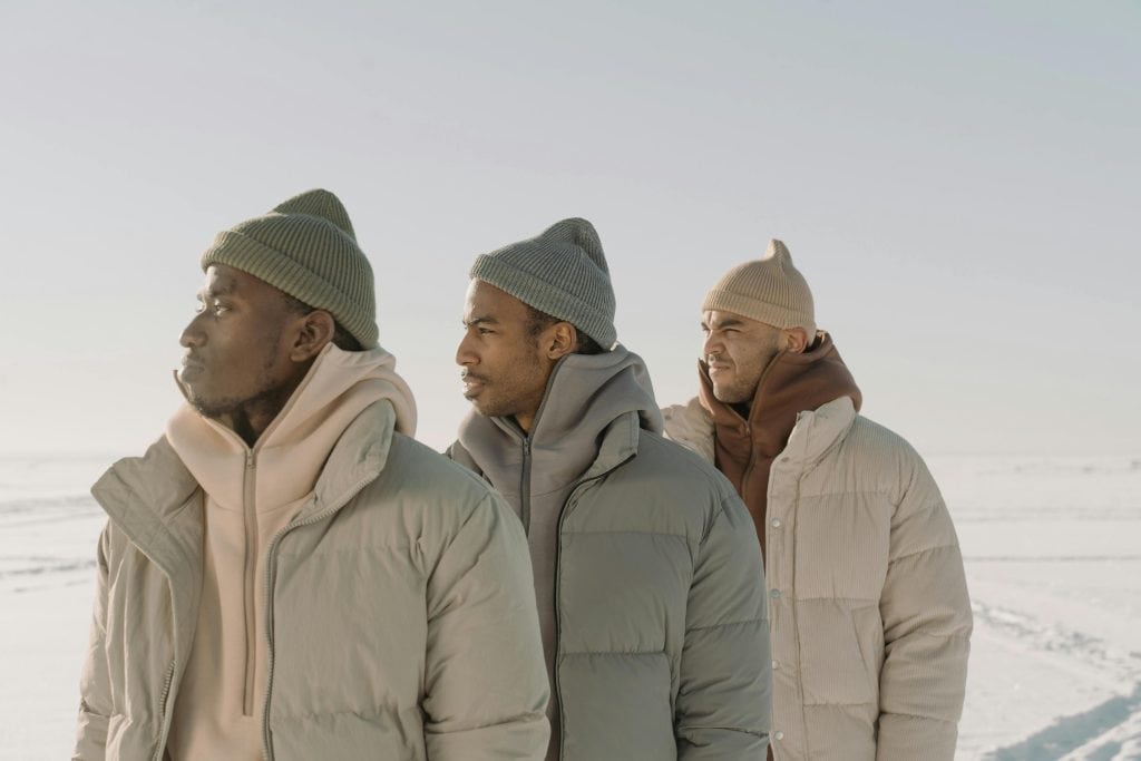 Warm winter puffer jackets and beanies for men, stylish outdoor apparel by Bryden Apparel.