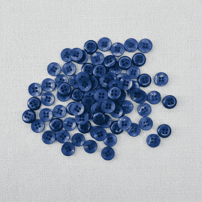 Buttons On Grey Fabric