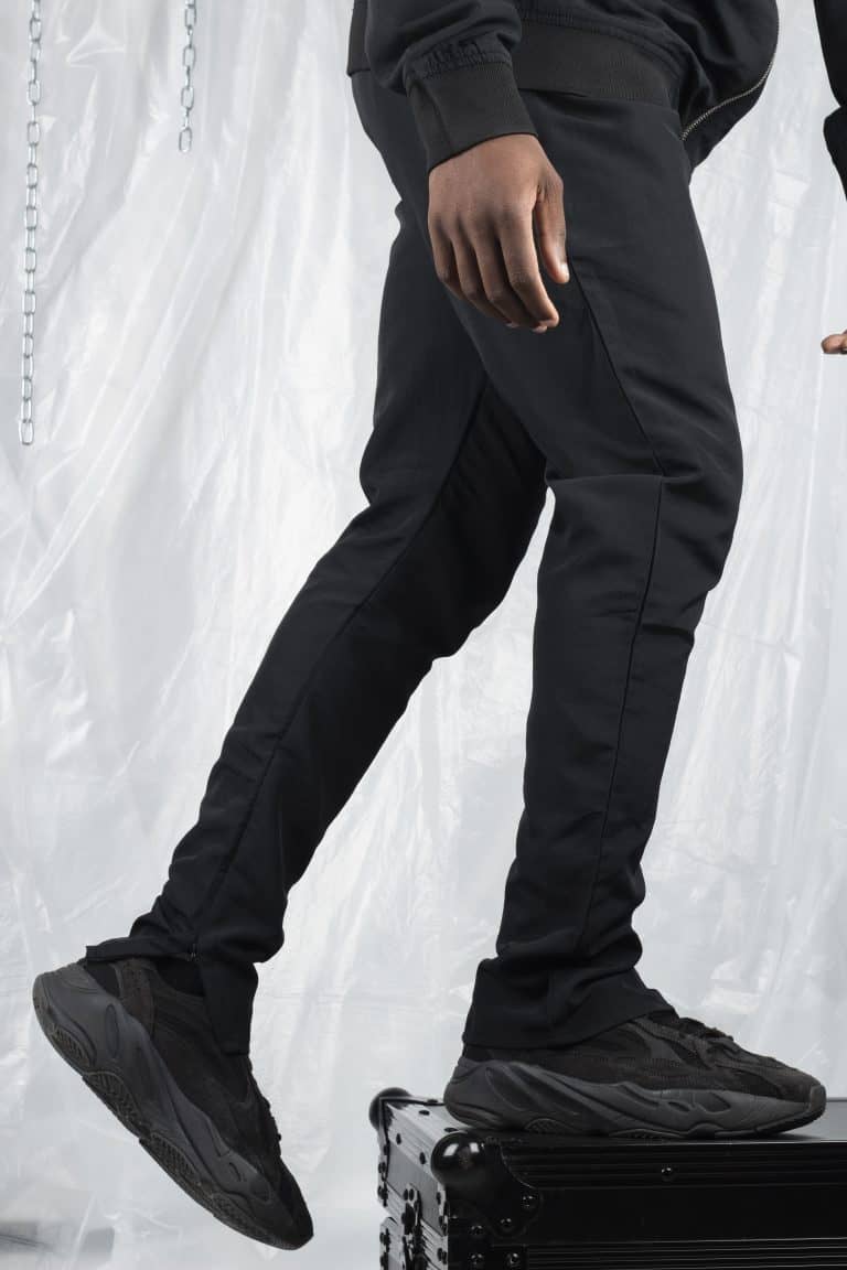 Men's black streetwear joggers with a relaxed fit and tapered design.