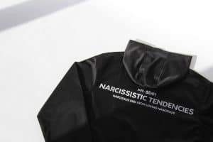 Black hoodie with "Narcissistic Tendencies" text and Narcissus quote, stylish streetwear.