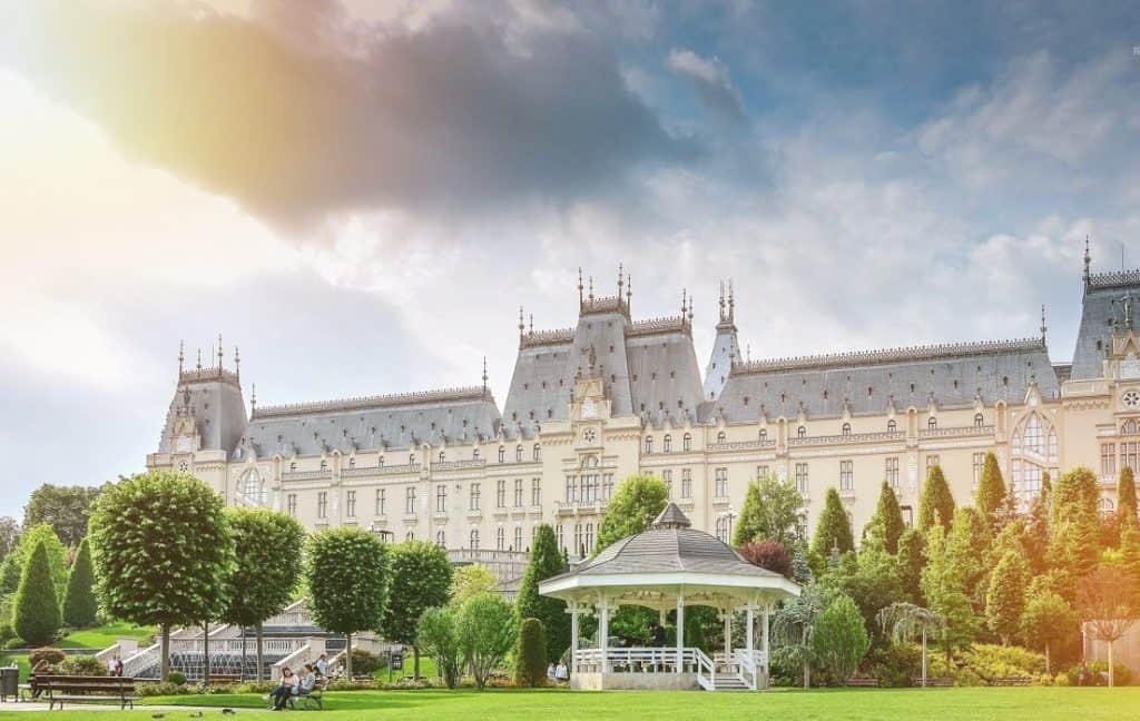 Elegant Iași Palace with lush gardens and historic architecture.