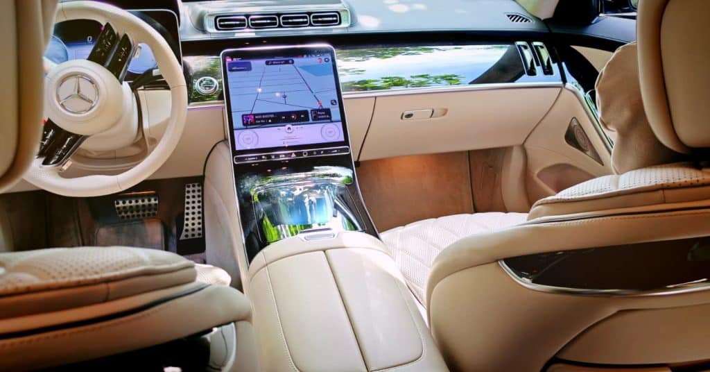 Luxury Mercedes S-Class interior with digital dashboard and premium cream leather finishes