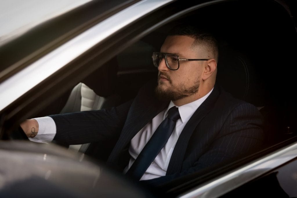 Professional Bud’s Cab chauffeur driving a premium vehicle in Bucharest