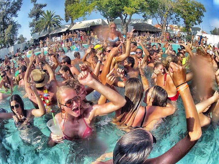 Crowded summer pool party in Mamaia with lively beach club atmosphere