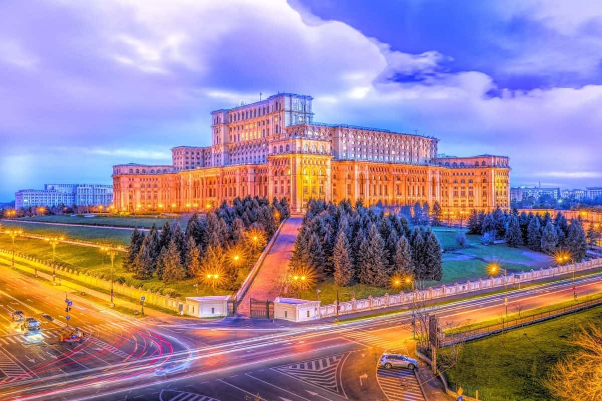 Palace of Parliament illuminated at dusk in Bucharest