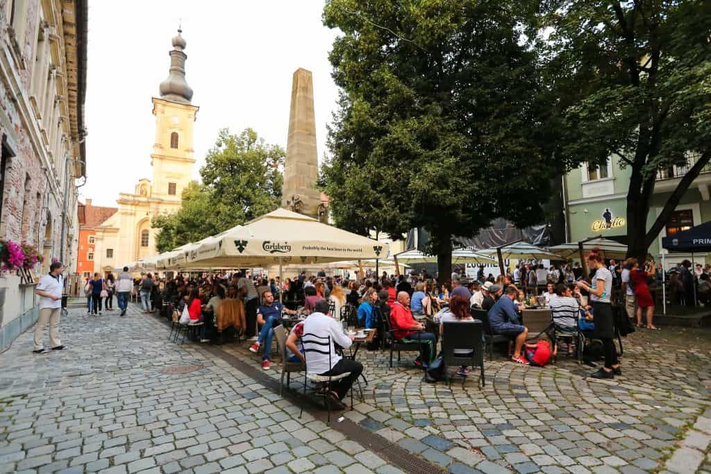 Museum Square in Cluj-Napoca with the Carolina Obelisk and Franciscan Church
