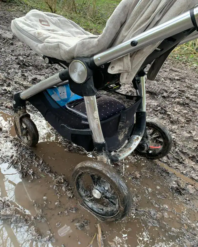 Poto of a very muddy pushchair