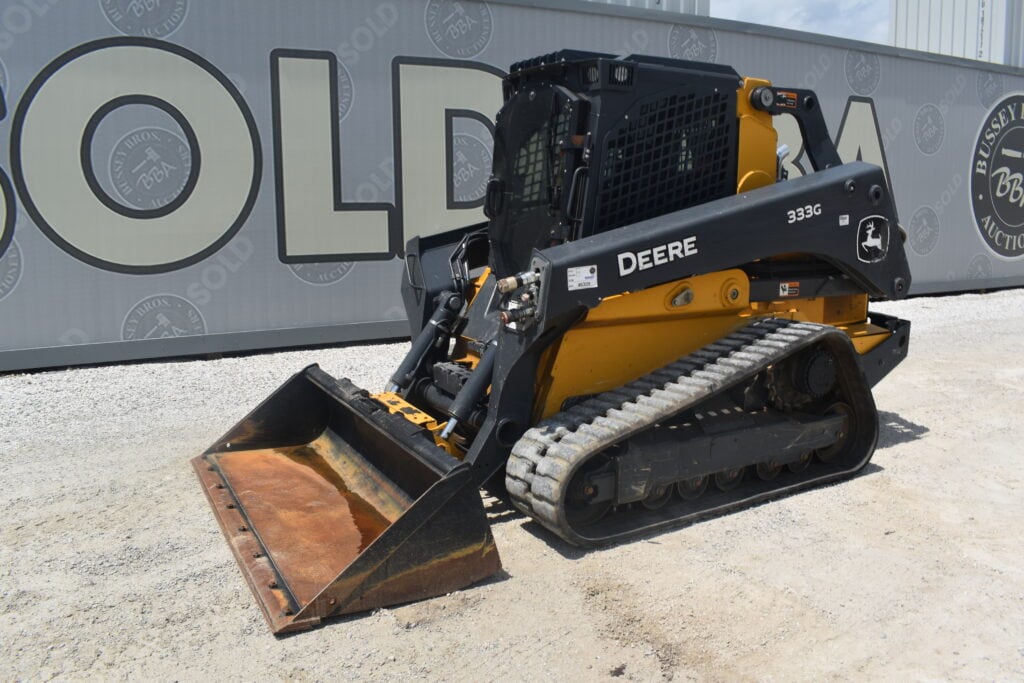 John Deere 333G compact track loader at heavy equipment auction.