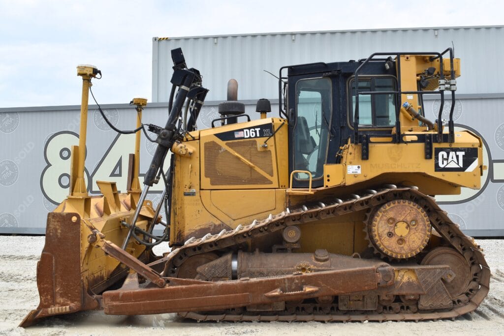 Caterpillar D6T bulldozer at heavy equipment auction site.