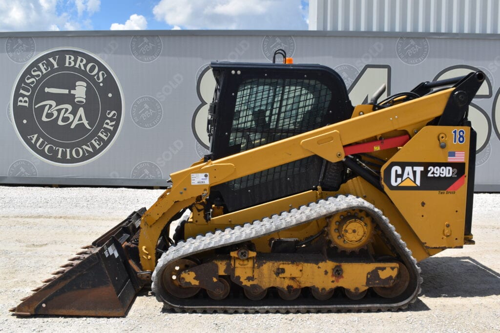 Yellow Caterpillar 299D2 compact track loader at heavy equipment auction.