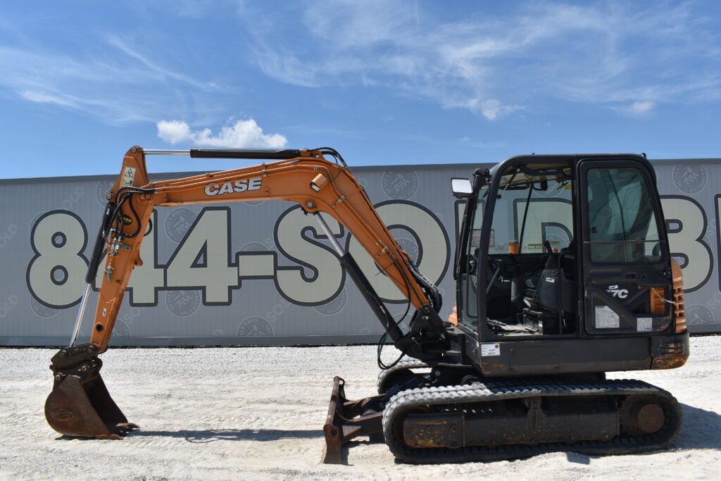 Orange CASE mini excavator at heavy equipment auction.