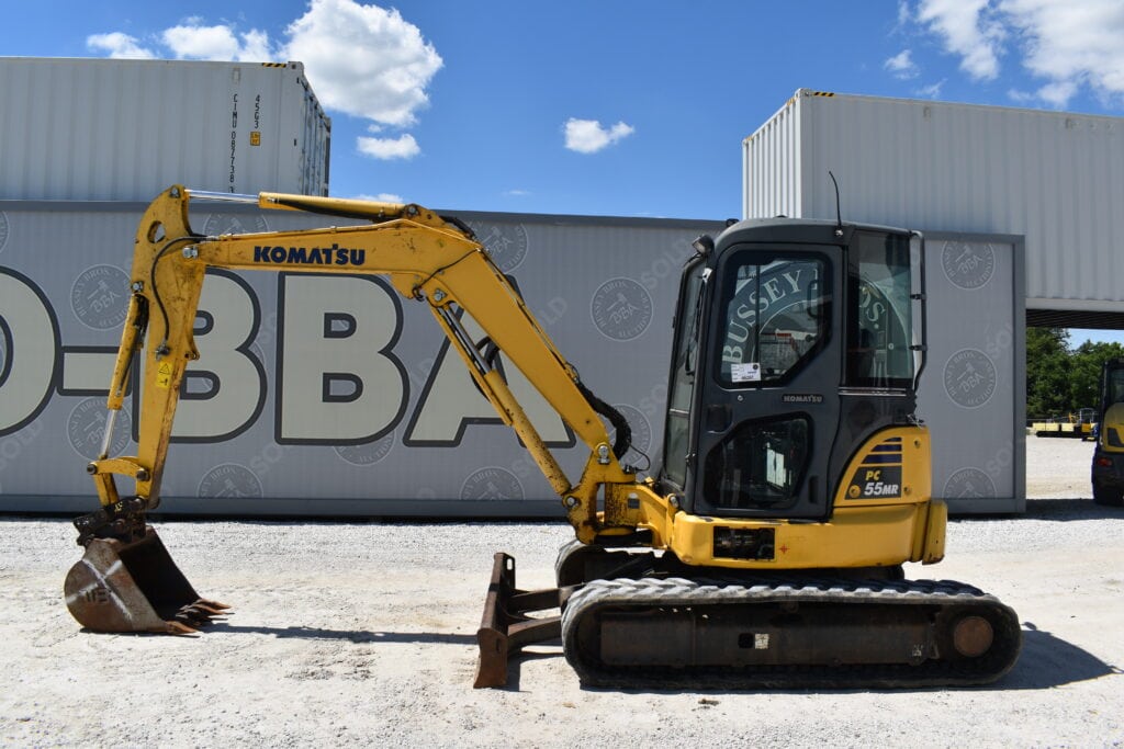 Yellow Komatsu mini excavator at Bussey Bros Auction.