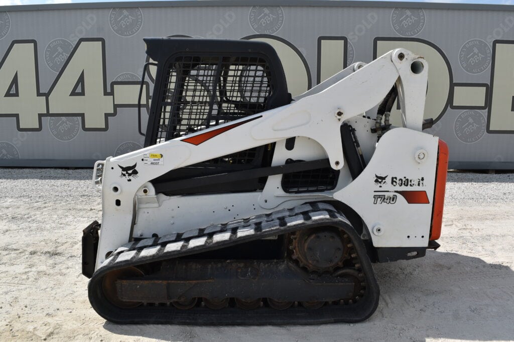 White Bobcat T590 compact track loader for heavy equipment auction.
