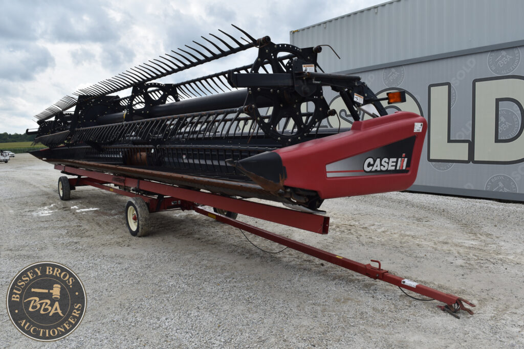 Case IH combine header at auction, heavy equipment for sale.