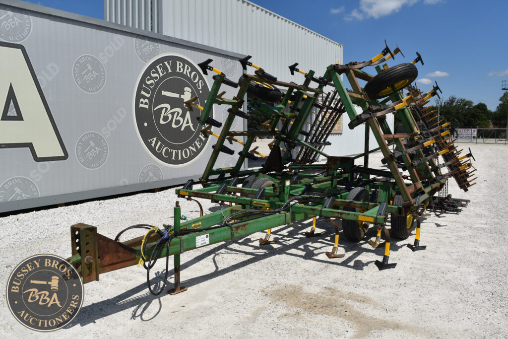 Farm equipment trailer at Bussey Bros Auction, ready for sale.