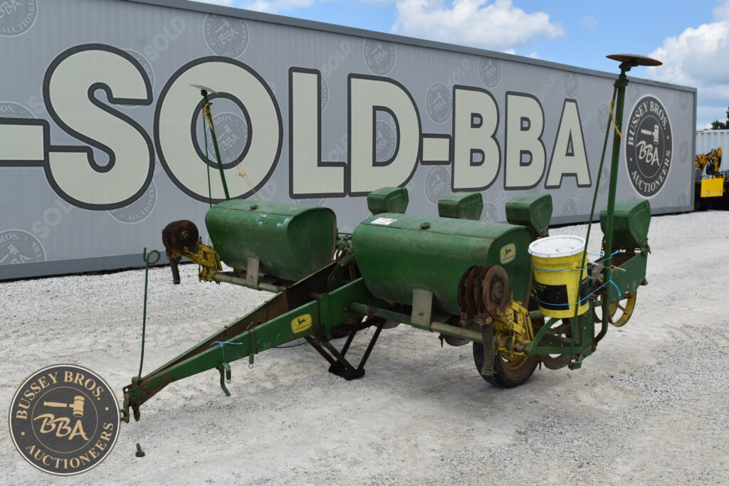 Green agricultural sprayer equipment at Bussey Bros Auction.