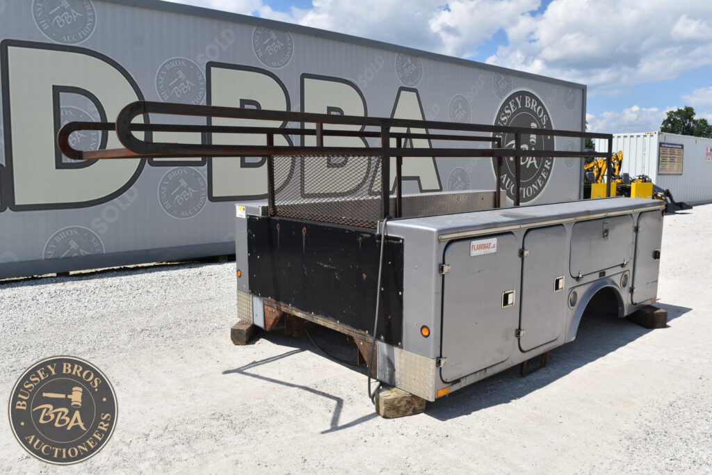 Auction trailer with tools and equipment at Bussey Bros Auctioneers.