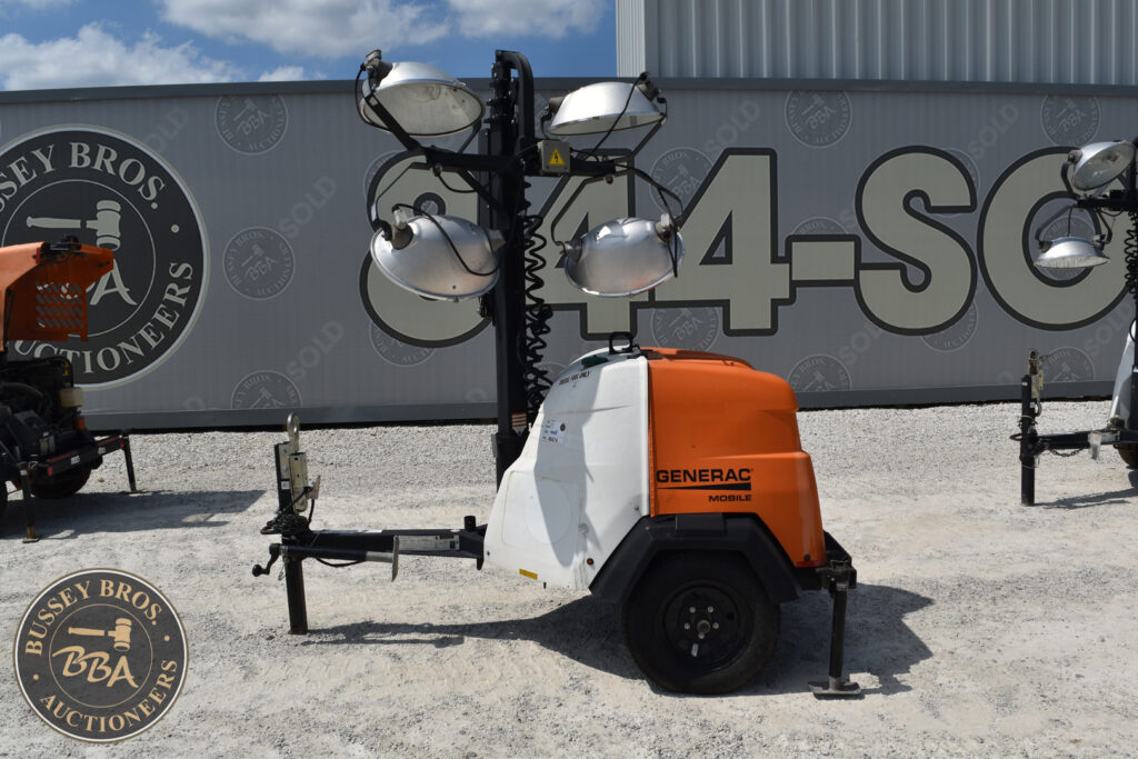 Portable light tower with Generac generator at heavy equipment auction.