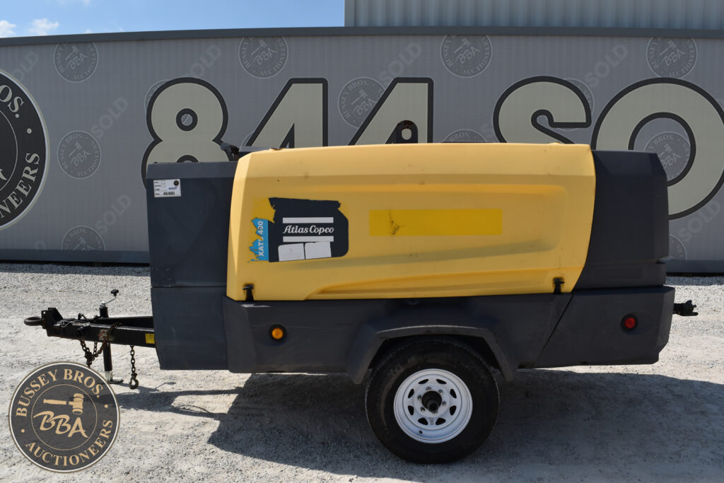 Yellow Atlas Copco portable air compressor for auction.