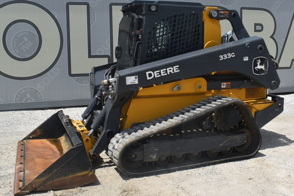 John Deere 333G compact track loader at heavy equipment auction.