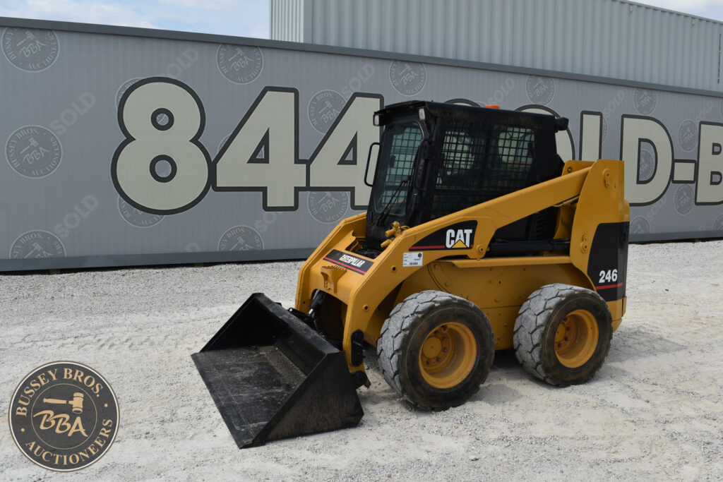 Yellow Caterpillar 246 compact loader at Bussey Bros auction site.