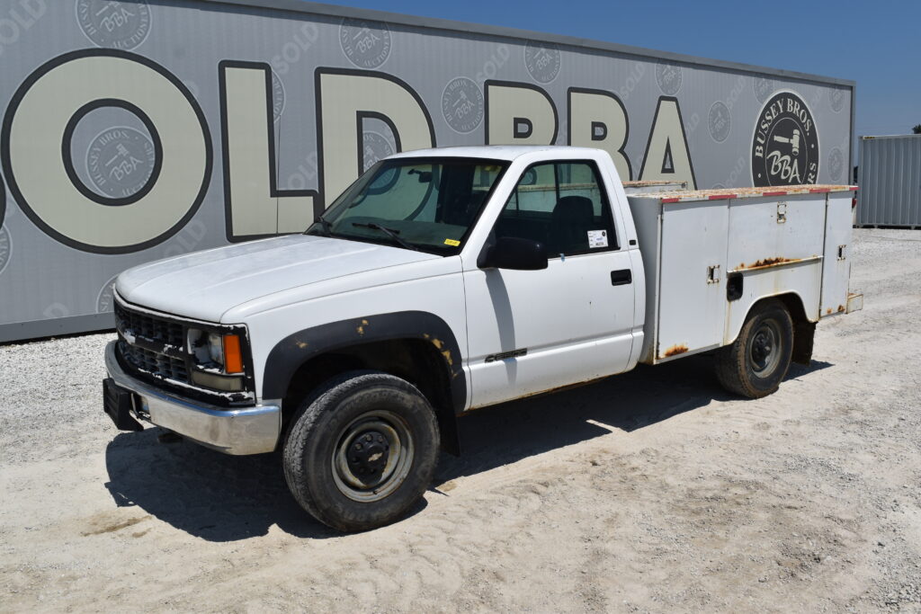White utility truck at Bussey Bros Auctioneers event.