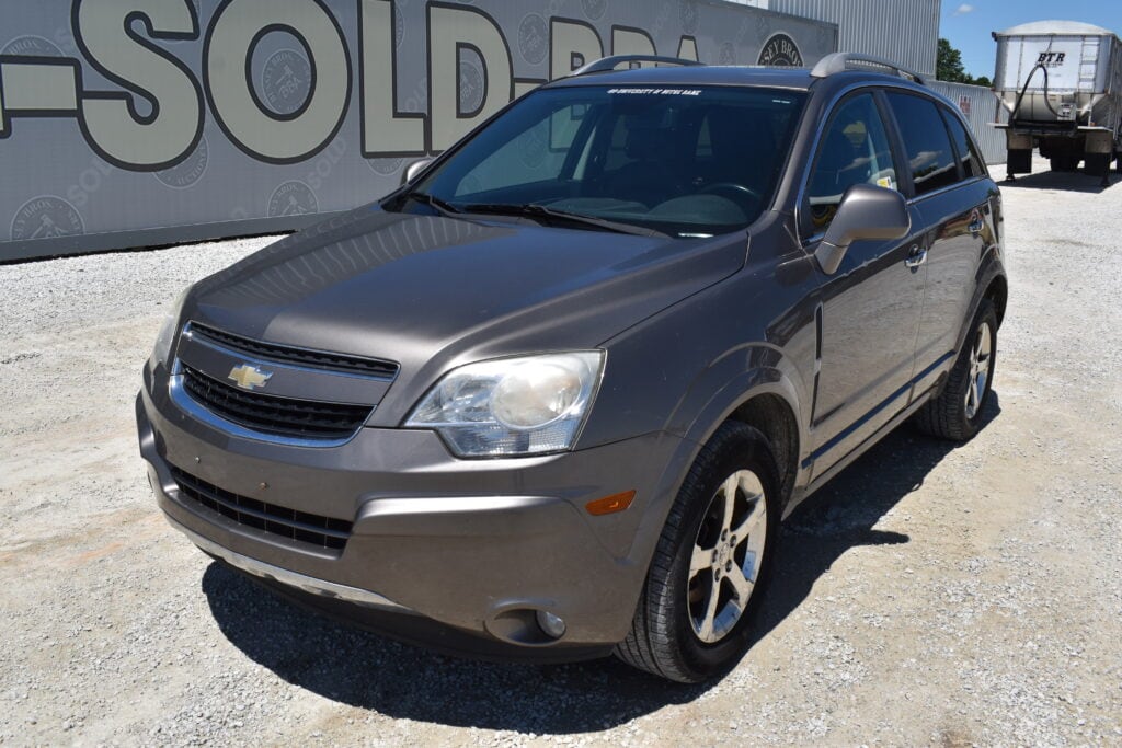 Pre-owned Chevrolet SUV parked outdoors at auction lot.