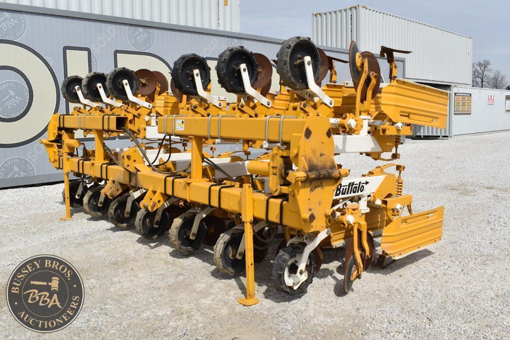 Yellow disc harrow used for soil cultivation at Bussey Bros Auctioneers.