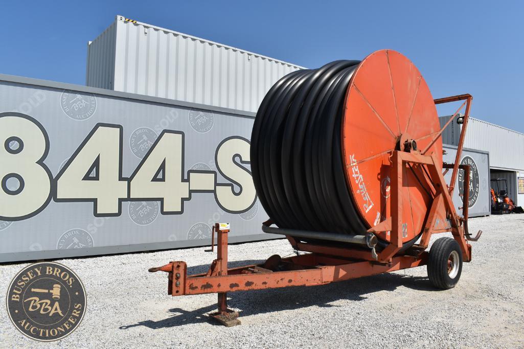 Large industrial hose reel on trailer at Bussey Bros Auctioneers facility.