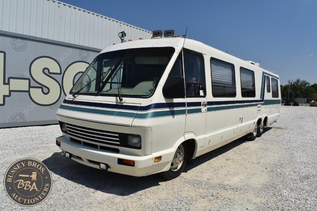Classic white bus for sale at Bussey Bros Auctioneers, ideal for conversions or transport needs.