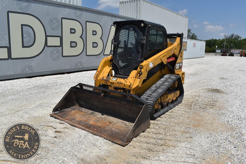 Yellow skid steer loader with front bucket at Bussey Bros Auction site.