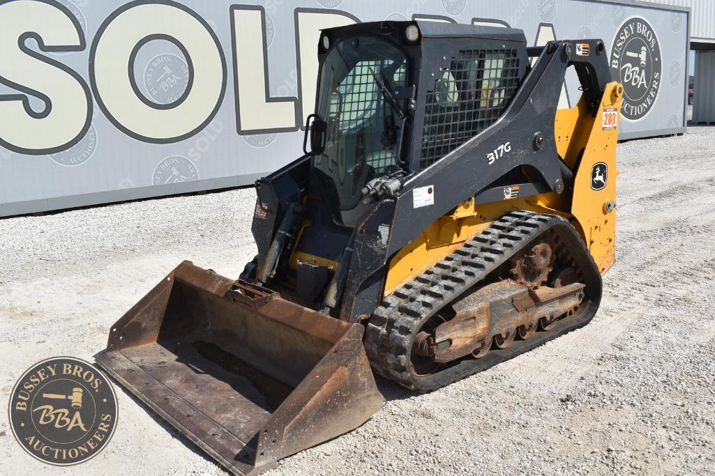 Excavator with tracked undercarriage and front blade, available for auction at Bussey Bros Auctionee.