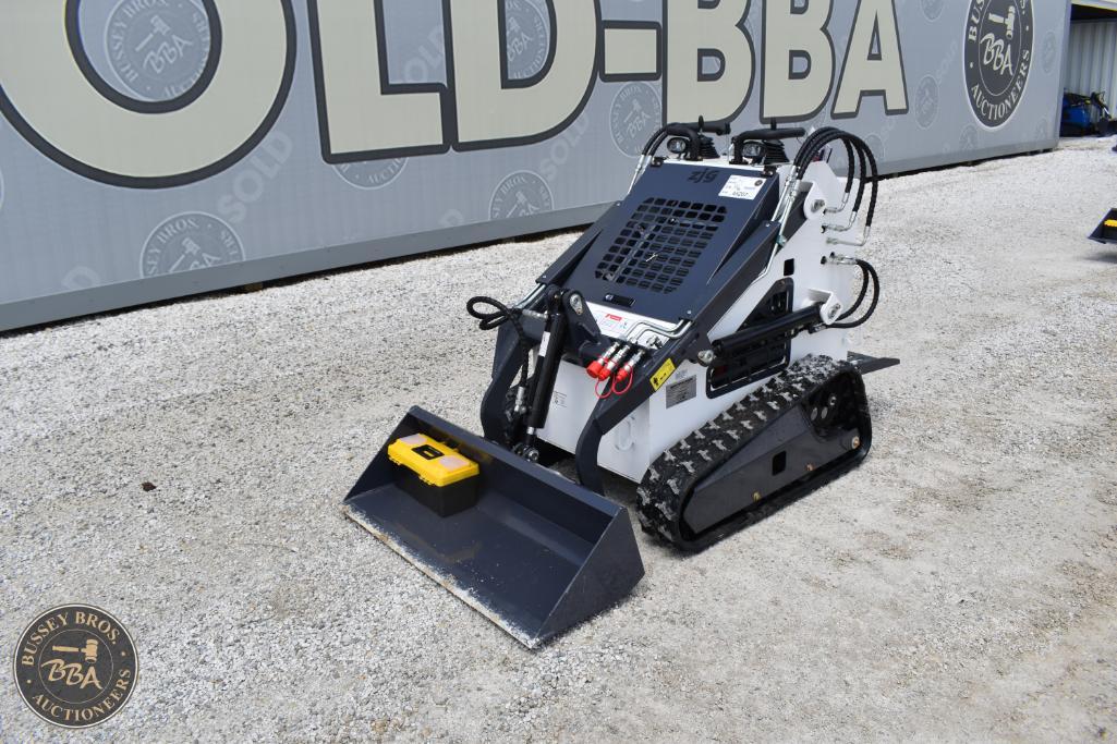 Tracked mini excavator for construction and landscaping projects.