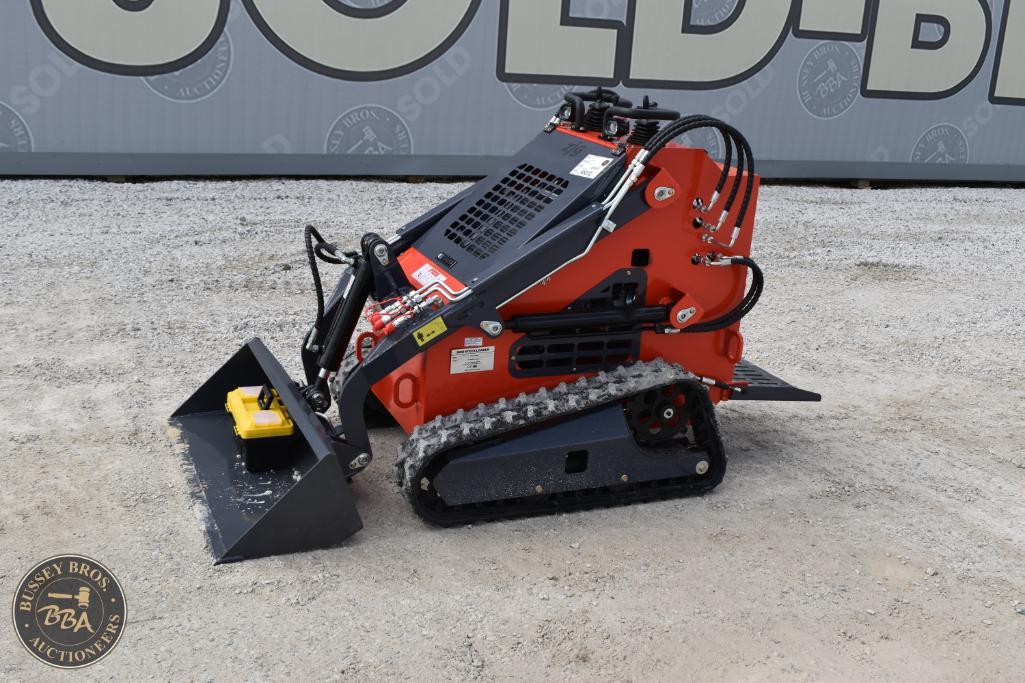 Compact mini skid steer loader with tracks, ideal for construction and landscaping projects.