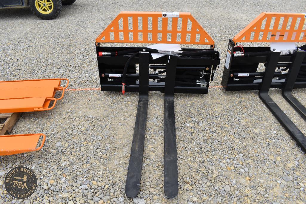 Forklift attachment with orange safety guard and black forks for material handling.