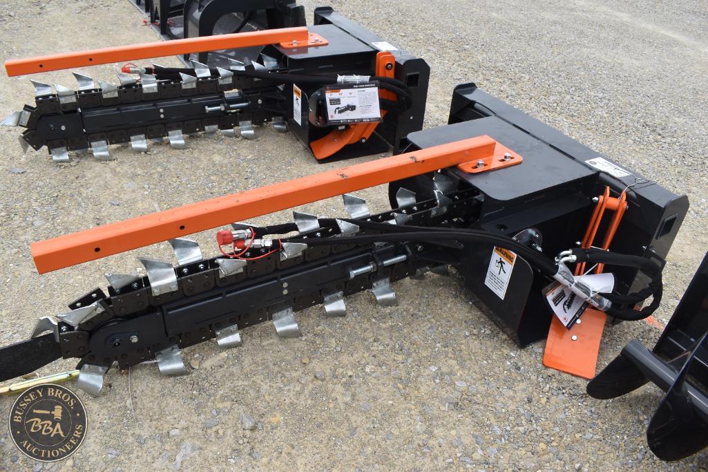 Farm equipment attachments with orange and black components, suitable for agricultural machinery.