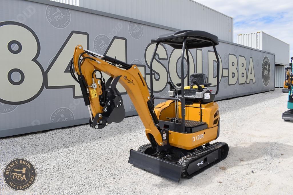 Compact yellow mini excavator with black tracks at Bussey Bros Auctioneers sale.