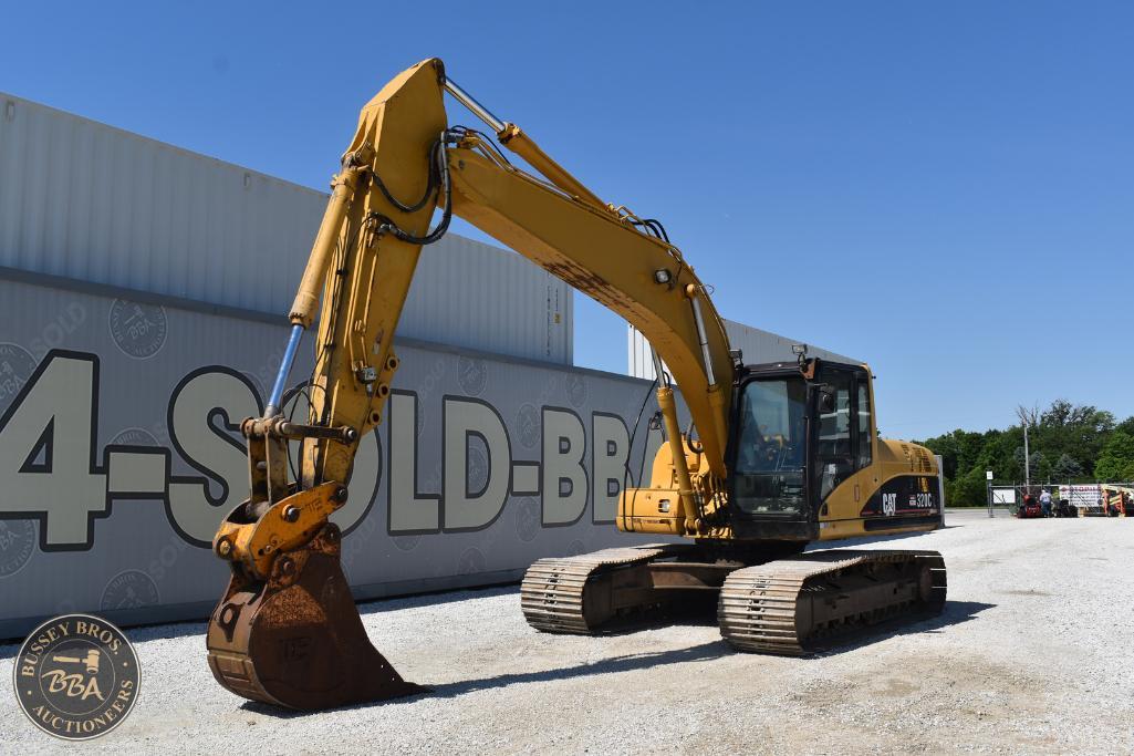 Excavator at Bussey Bros Auctioneers lot for equipment sale.