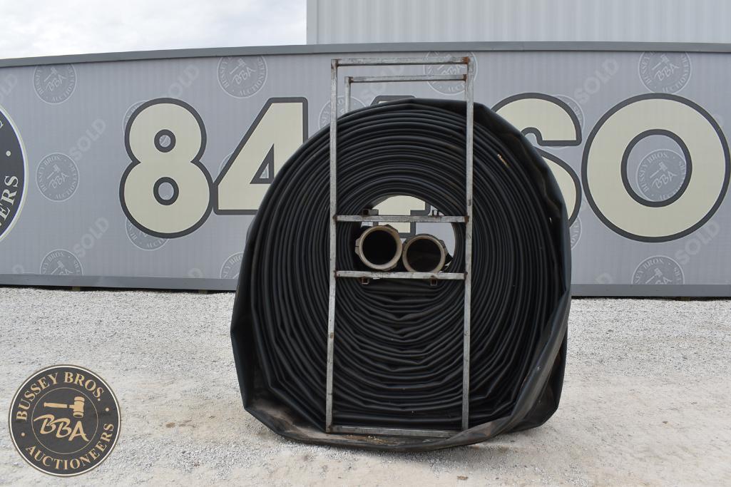 Industrial rubber hose coiled and secured for auction at Bussey Bros.