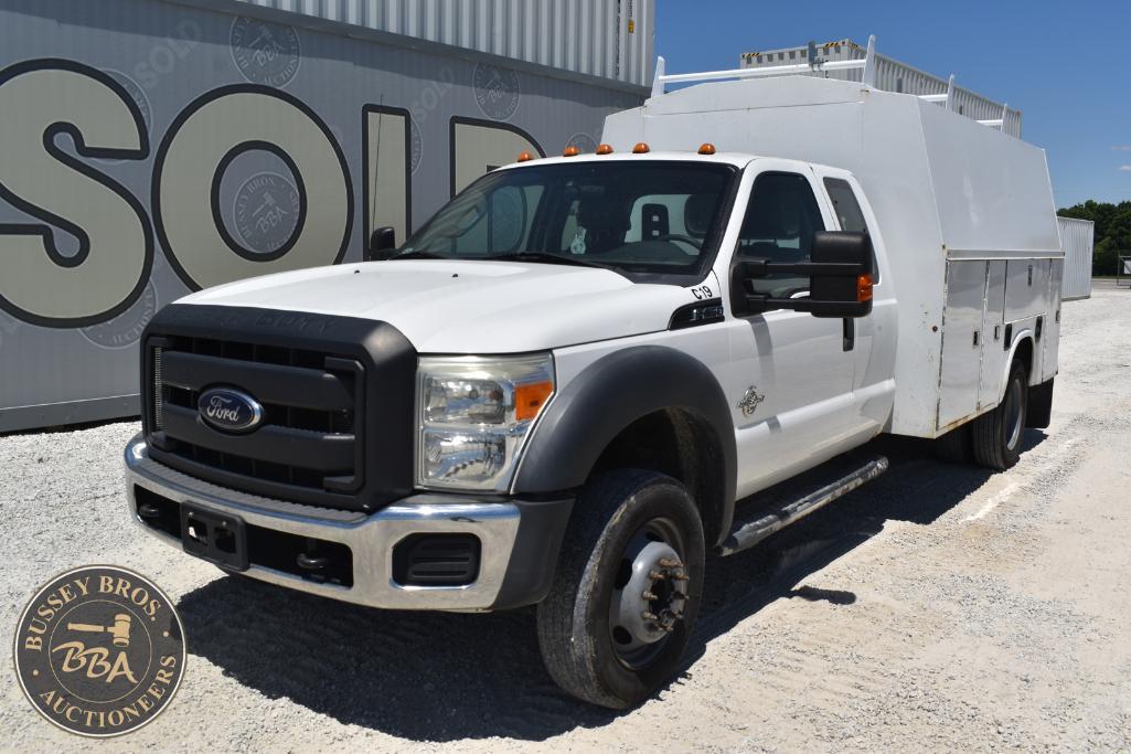 White Ford utility service truck with storage compartments, ideal for commercial or maintenance use.