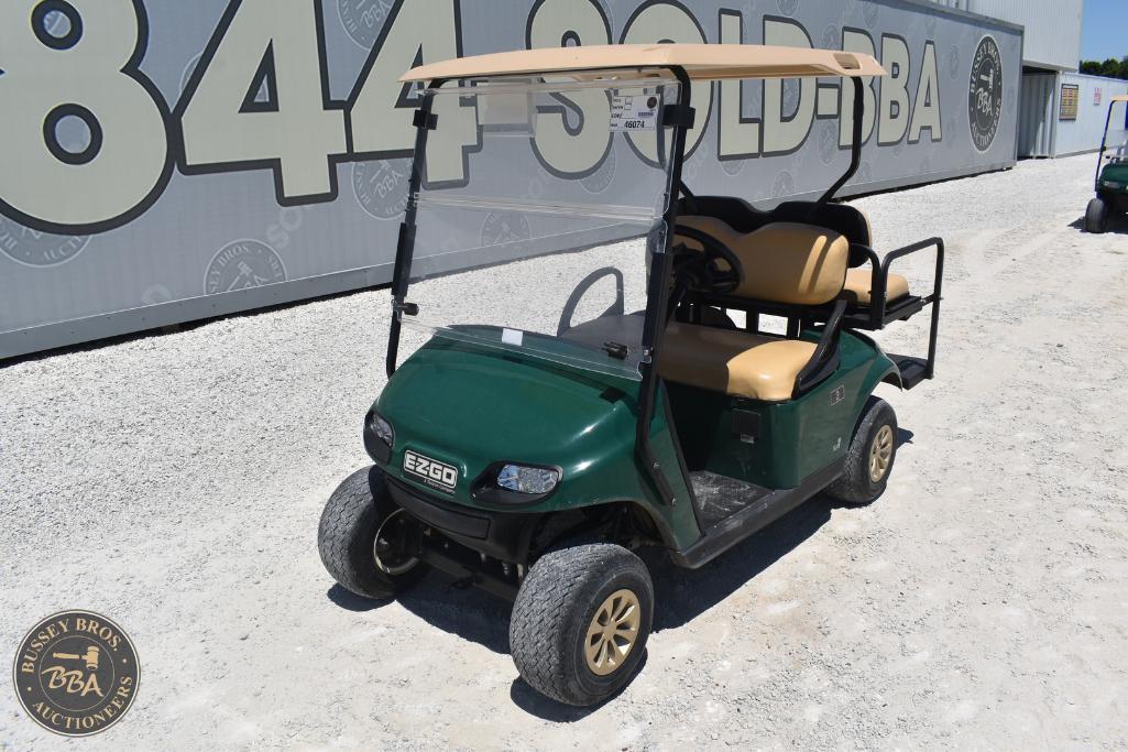 Golf cart with beige seats and green body, ideal for golf courses or transportation needs.