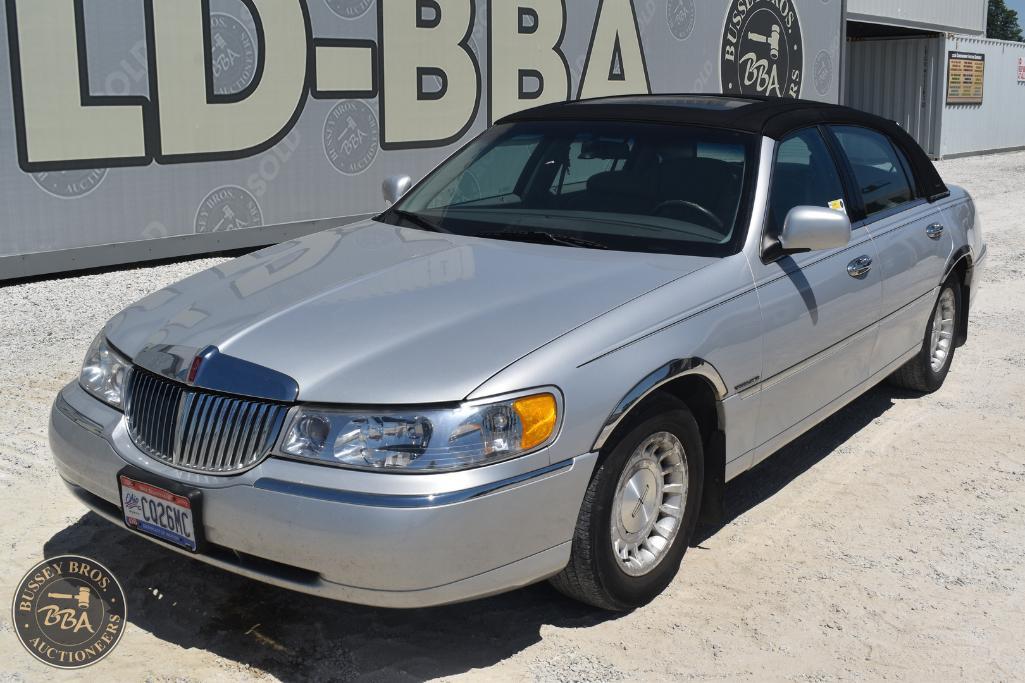 Elegant silver sedan showcased at Bussey Bros Auctioneers, perfect for car enthusiasts and collector.