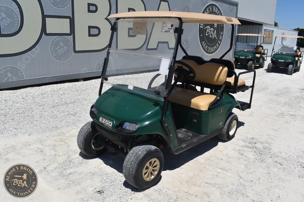 Golf cart parked outdoors at Bussey Bros Auctioneers, ready for auction or transport purposes.