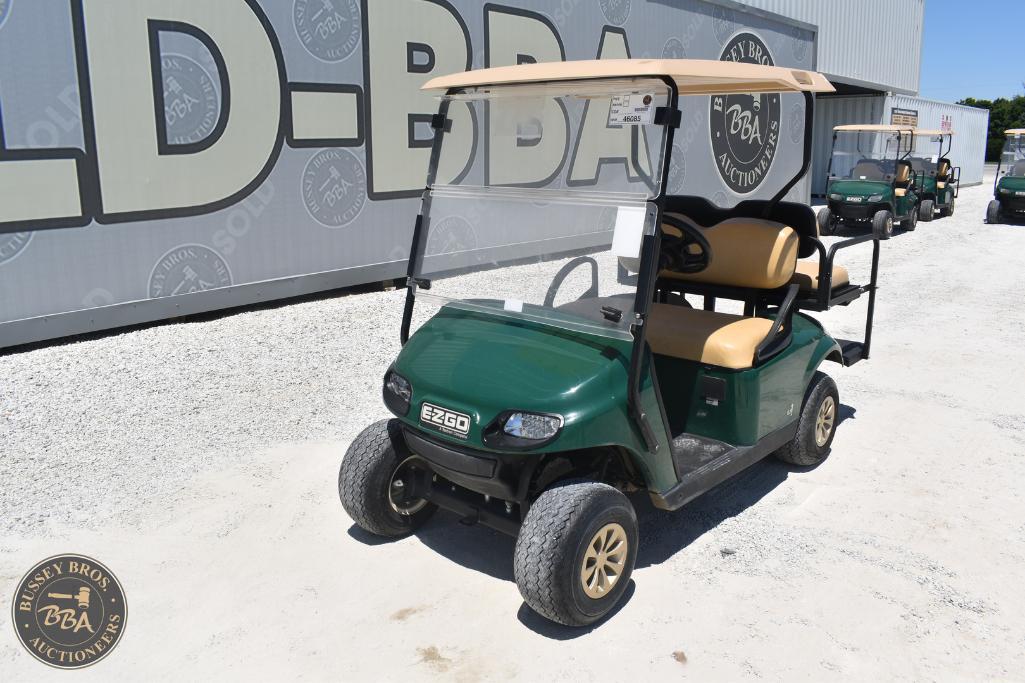 Golf cart for auction with beige seats and green body, ideal for golf courses or transportation need.