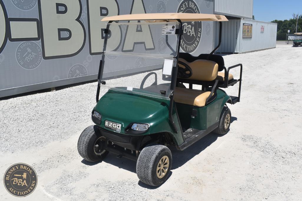 Golf cart with beige seats and green body, ideal for leisure or transportation needs.