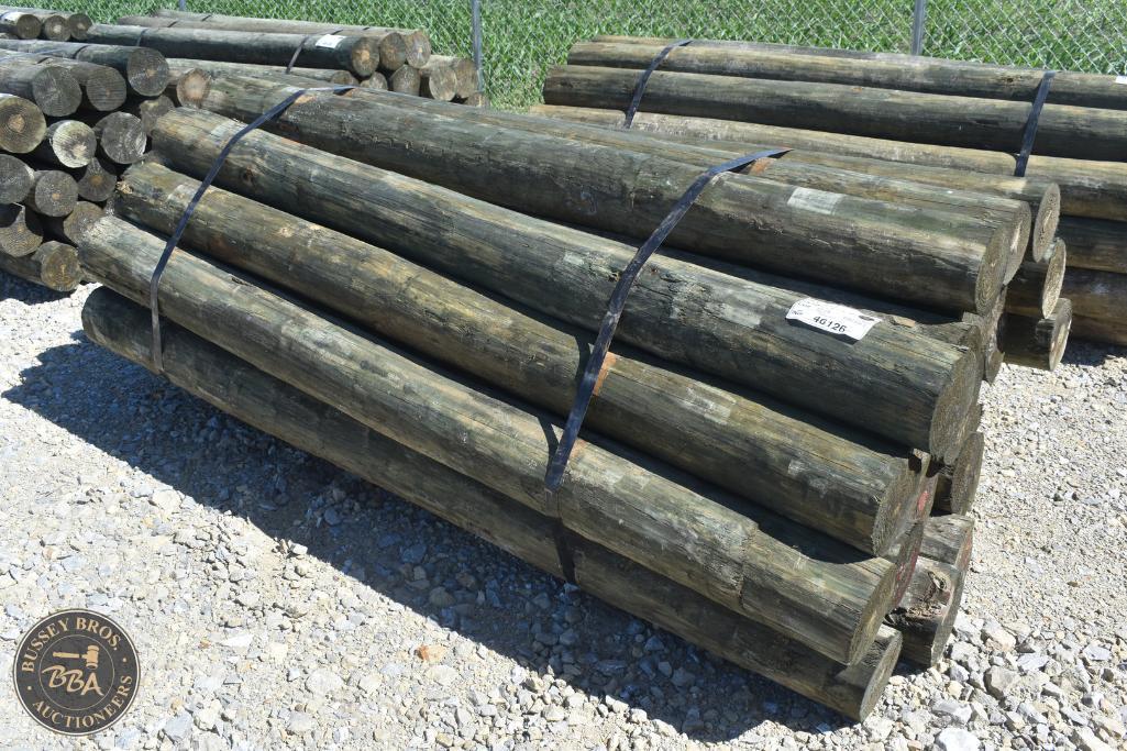 Wooden logs for sale at Bussey Bros Auctioneers, ideal for construction or landscaping projects.
