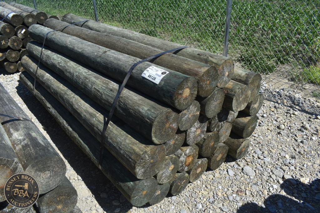 Wooden logs for sale at Bussey Bros Auctioneers, ideal for construction or firewood.
